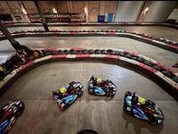 Karts running through a corner on the Gridline Racing circuit