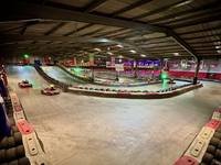 The Gridline Racing circuit lit up, looking along the barriers
