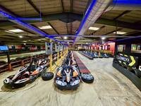 Electric SODI karts parked in the pit lane at Gridline Racing