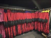 Race suits on the rail at Gridline Racing
