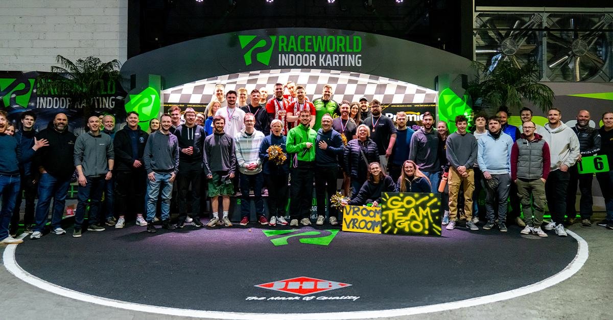Group event podium celebration at RaceWorld