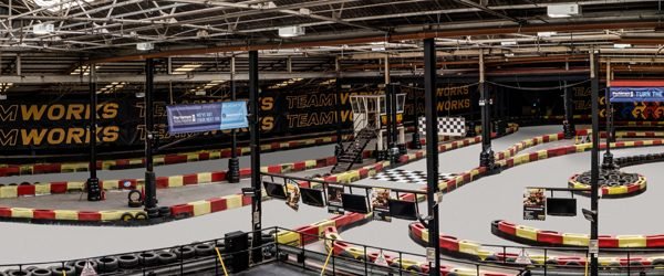 Elevated view across the full indoor circuit at Teamworks Karting Birmingham City